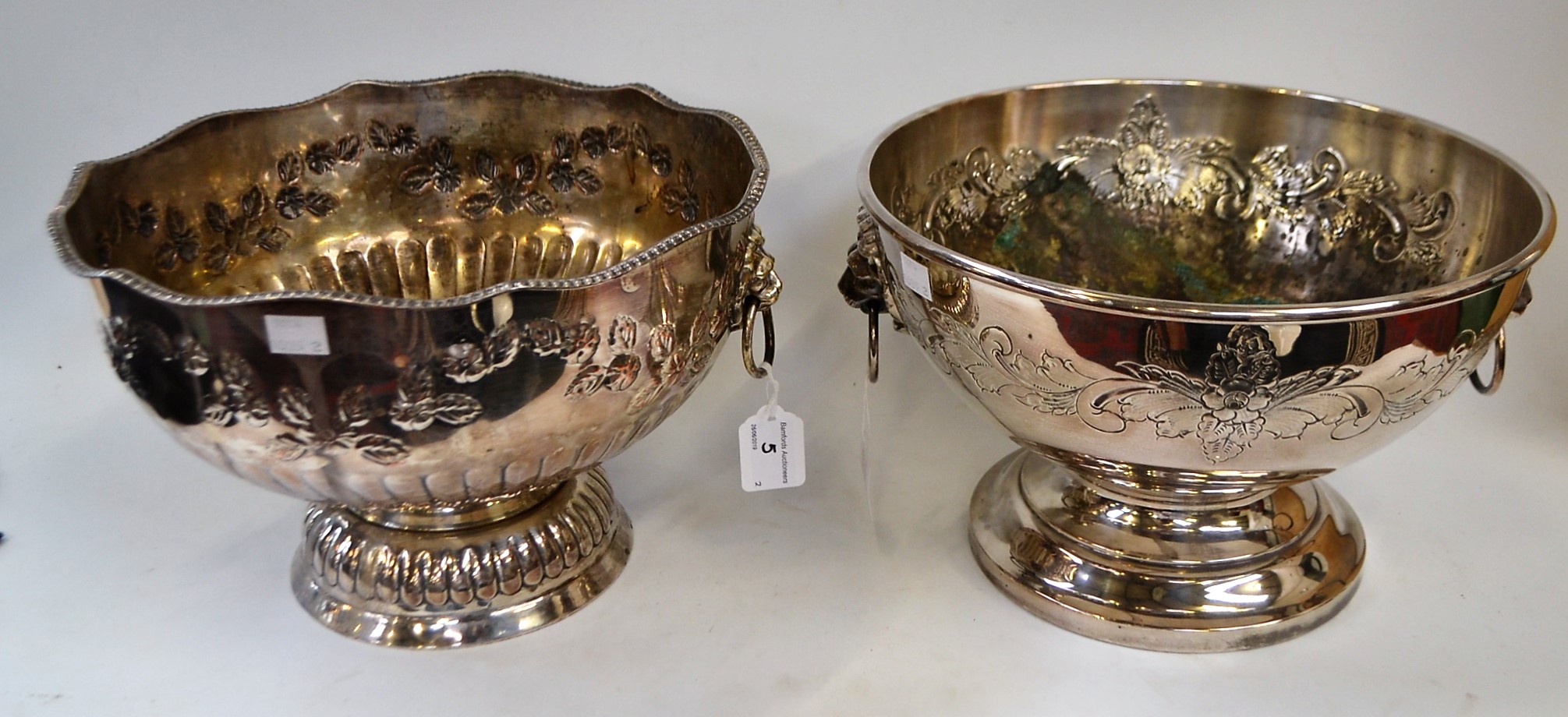 A silver on copper punch bowl, gadrooned rim, embossed throughout flowers and foliage,