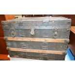 An early-mid 20th century metal mounted trunk, hinged cover,