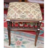 A Victorian piano stool, padded seat, spindled gallery,