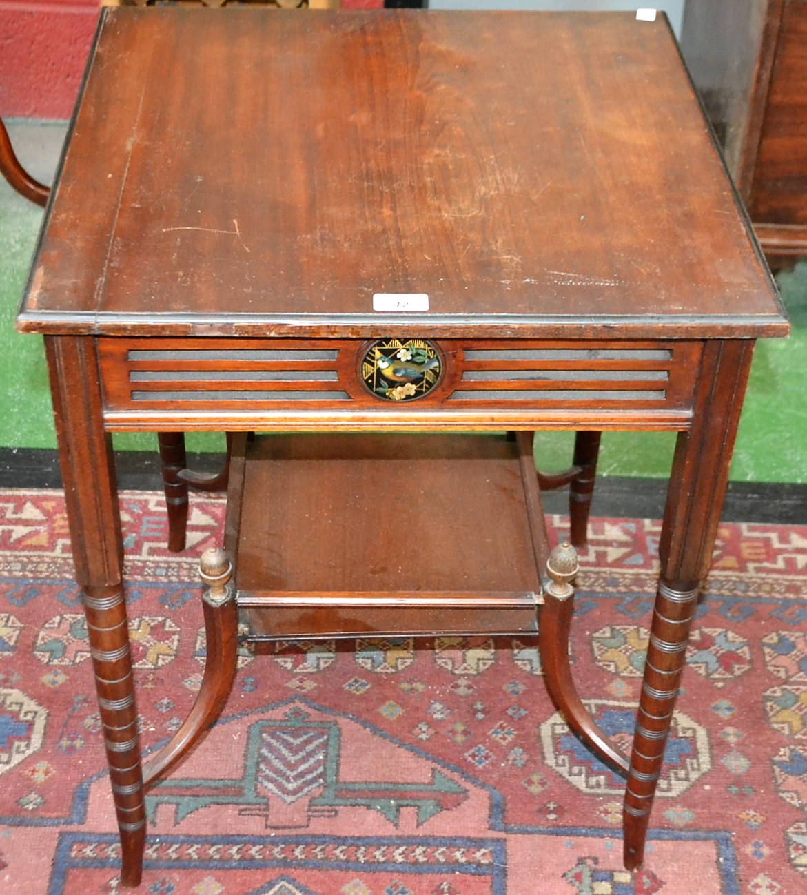 An Aesthetic Movement mahogany occasional table, moulded square top above a pierced frieze,