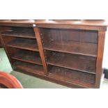 A 20th century oak bookcase, moulded rectangular top above an arrangement of shelves, plinth base,
