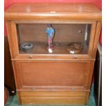 A Globe Wernicke type bookcase, rectangular top above two horizontally hinged and retractable doors,