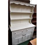 A white painted dresser, shelving to top,