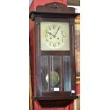 An early 20th century mahogany cased wall clock