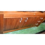 A contemporary teak effect sideboard,