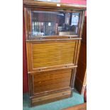 A Globe Wernicke type bookcase, rectangular top above two horizontally hinged and retractable doors,