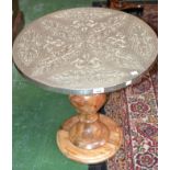 A contemporary occasional table, circular top overlayed with embossed foil, turned column,