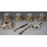 A set of four Royal Crown Derby Asian Rose pattern coffee cans and saucers,