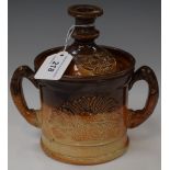 A Derbyshire salt glazed two handled loving cup, applied pheasant and hare decoration,