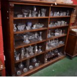 A Victorian walnut open library bookcase, moulded rectangular top above two rows of shelves,