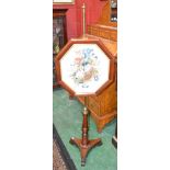 A William IV style mahogany pole screen, height adjustable octagonal frame,