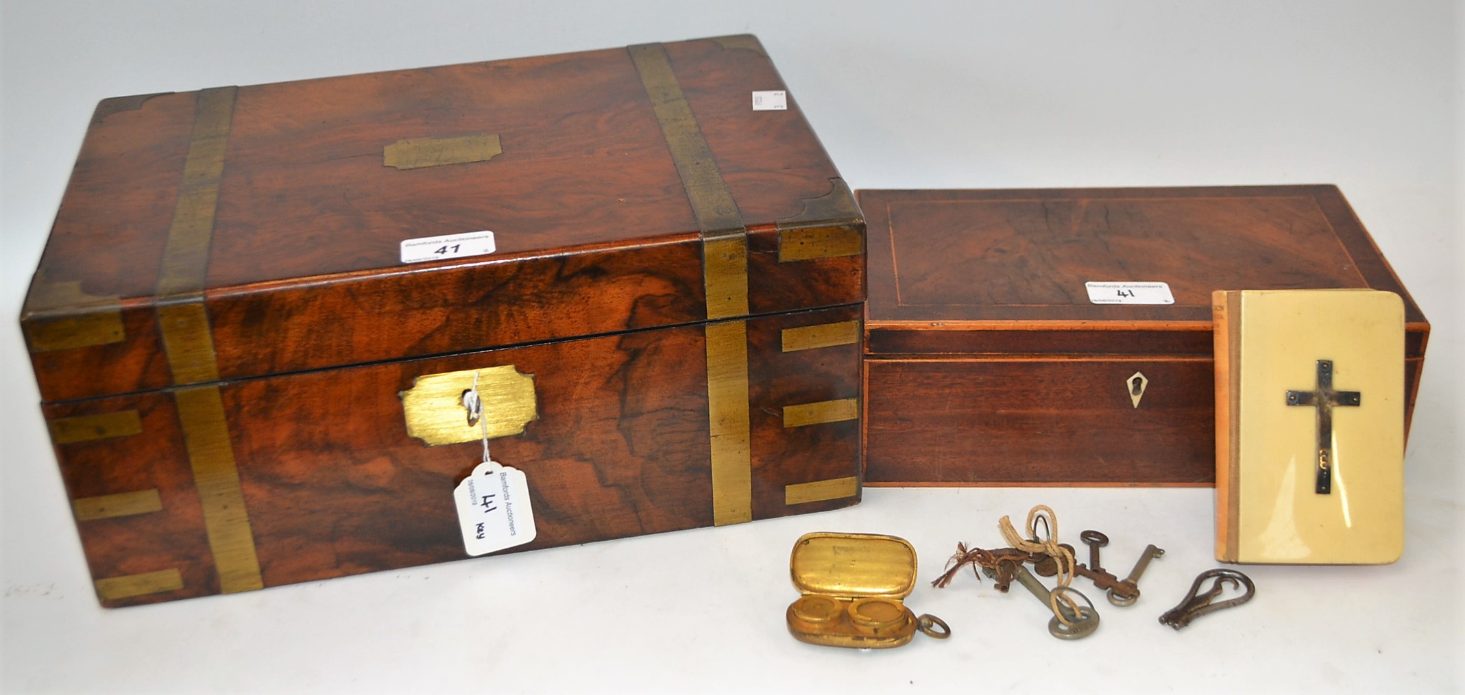 A brass bound writing slope; a boxwood inlaid work box; sovereign case; silver inlaid prayer book,