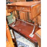 A reproduction flame mahogany sofa table;