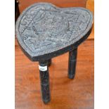 An Arts and Crafts three legged footstool,