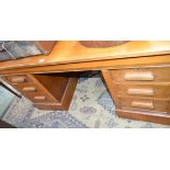 A 20th century oak plan type desk, rectangular top with shallow partial three-quarter gallery,