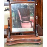 A Victorian mahogany dressing mirror, rectangular plate, scroll supports, incurve base,