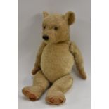 An English jointed mohair bear, horizontal stitched nose, growler, humped back, straw filled,