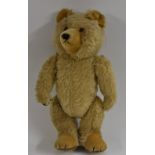 A Musical gold plush Teddy Bear, possibly Deans Rag Book Co, centre seamed body, glass eyes,