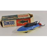 A 1960s Fairylite Stingray plastic friction drive model, in two tone blue and yellow, silver fins,