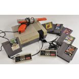 Vintage Computing/Gaming - a 1980s Nintendo Entertainment System (NES) games console, 2 controllers,