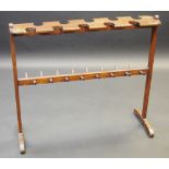 A late Victorian/Edwardian mahogany boot and whip rack, sledge base, 84cm high, 96cm wide, c.