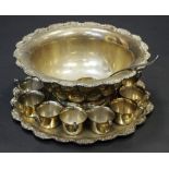 An Italian silver plated punch bowl, stand, ladle and twelve punch cups,
