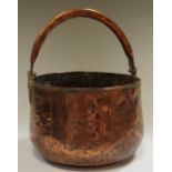 A 19th century planished copper jam pan with swing handle