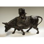 A Chinese bronze boy riding a bull,