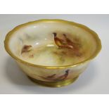 A Royal Worcester bowl, decorated by Jas Stinton, signed, with pheasants and hen, burnished gilt,