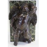 English School, 19th century, a brown patinated bronze desk weight, of a cherub reclining,