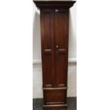 A Victorian tall oak estate office filing cabinet of slender proportions,