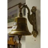 An early 20th century brass ship's bell with griffin bracket c.