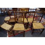 A harlequin set of four elm rush seated side chairs; another;