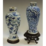 A Chinese baluster vase, decorated with dragons, peonies and foliage, 24cm high,