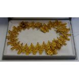A 1970s gilt metal Vendome modernist textured bark necklace, compression clasp,
