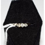 A 9ct gold three stone diamond ring