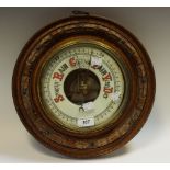 An early 20th century circular aneroid barometer,