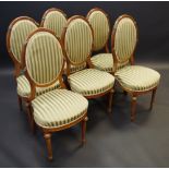 A set of Louis XVI style salon chairs, oval padded back, padded seat, turned forelegs c.