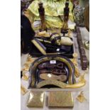 An ebony silver mounted dressing table set comprising tray, hand mirror, clothes brush,