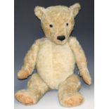 An English jointed mohair bear, horizontal stitched nose, growler, humped back, straw filled,