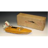 A retro vintage 1960's Monteleone Piper 656 battery operated speed boat, tan hull, lift off motor,