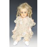 A 19th century style wax doll, blue glass eyes, open mouth, red lips, long blond curly hair,