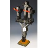 A Gebruder Bing O gauge tin plate three arm signal tower,