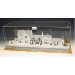 A static model of an 1875 Railway Station, perspex case, wooden outer case,
