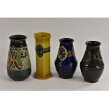 A Bourne Denby tube lined baluster vase, decorated with stylised lilies, 20cm,