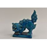 A Minton majolica temple dog, turquoise glaze, rectangular plinth base, 19cm wide,