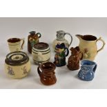 A Bourne Denby treacle glazed Toby jug, 15cm, printed mark; another in polychrome; a water jug,