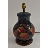 A Moorcroft Finches pattern baluster table lamp, tube lined with birds perched amongst ripe fruit,