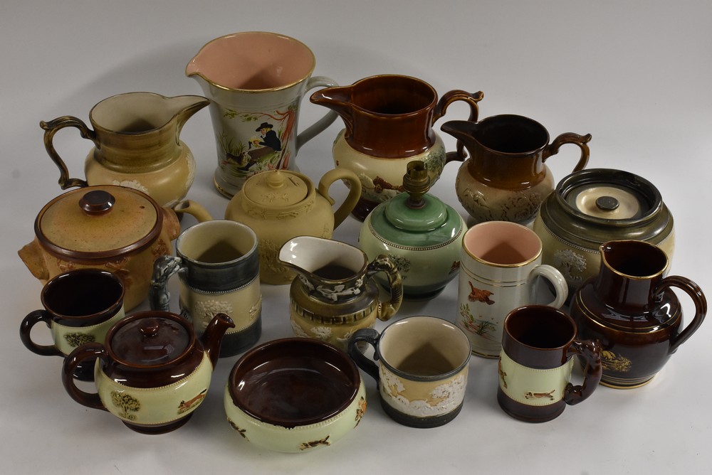 A Bourne Denby terracotta teapot, sprigged in low relief with huntsman and hounds giving chase,