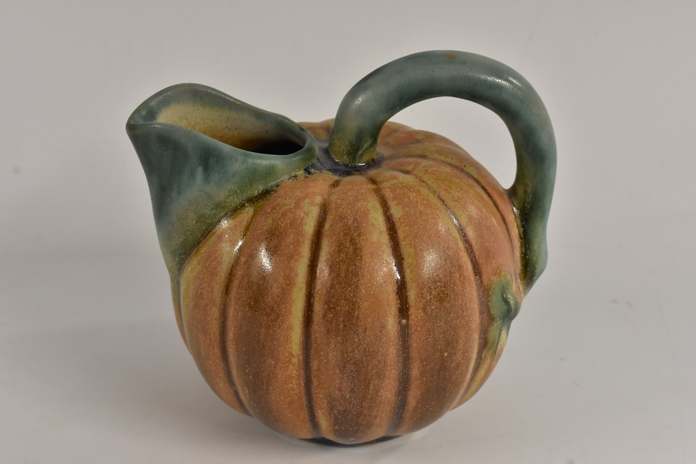 An unusual Bourne Denby lobed ovoid pumpkin shaped jug, loop handle, lipped spout, 13.
